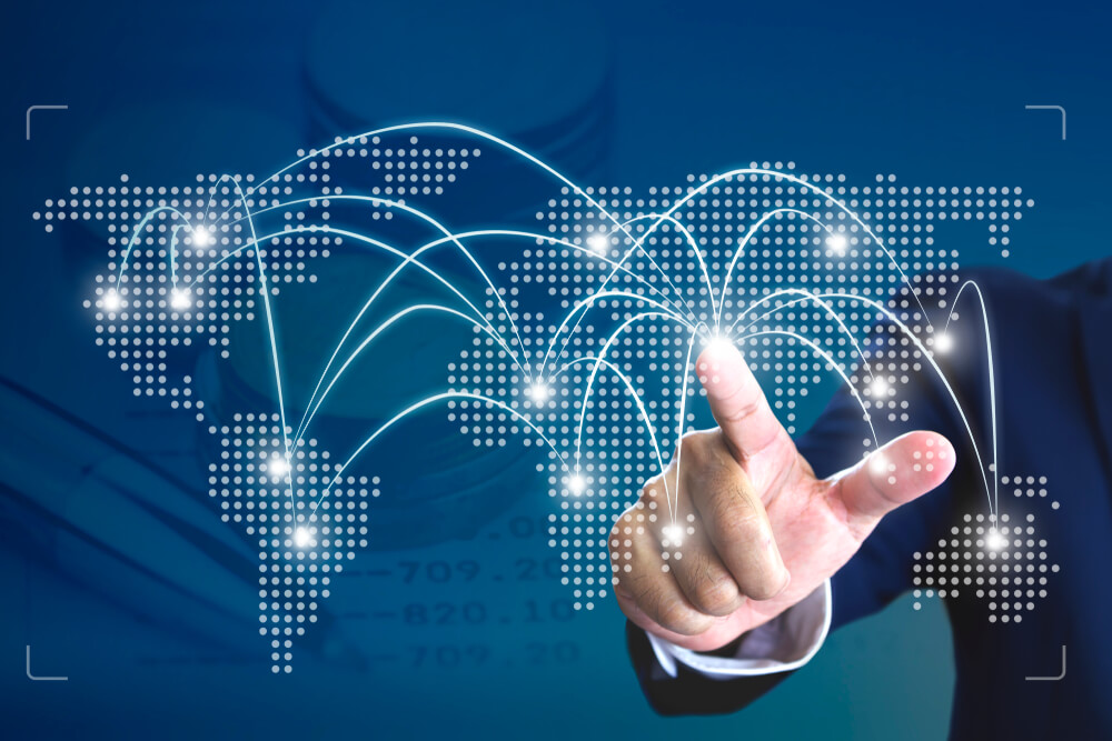 market expansion_Businessman touching a starting point on a virtual map to turn on an operation for a business expansion around the world