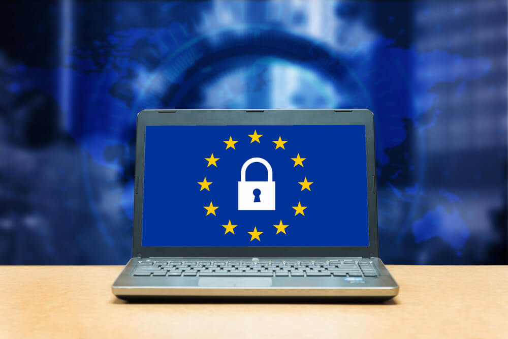 GDPR_General Data Protection Regulation - laptop on a table, blue screen with GDPR