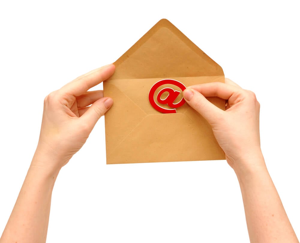 email marketing_Envelope and e-mail in the hands of women