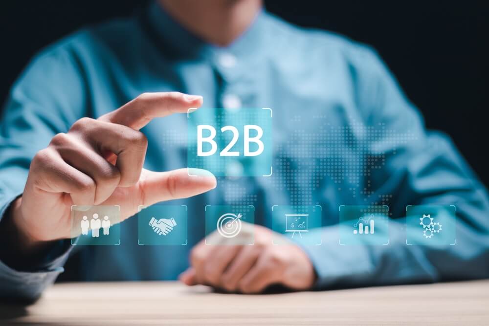 B2B_B2B marketing concept, business to business, e-commerce, businessman with B2B icons for professional business and commerce collaboration. business action plan strategy.