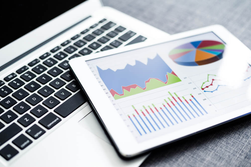 analytics_Business charts and diagrams on digital tablet