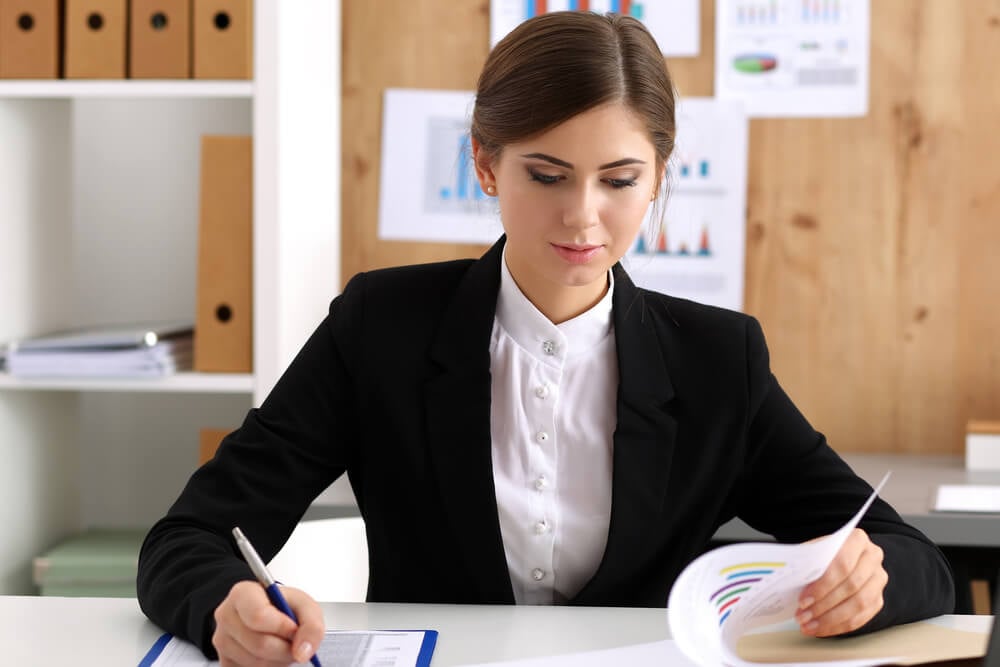 CMO_Beautiful businesswoman sit at workplace in office work with papers portrait. Serious business, exchange market, job offer, analytics research, excellent education, certified public accountant concept