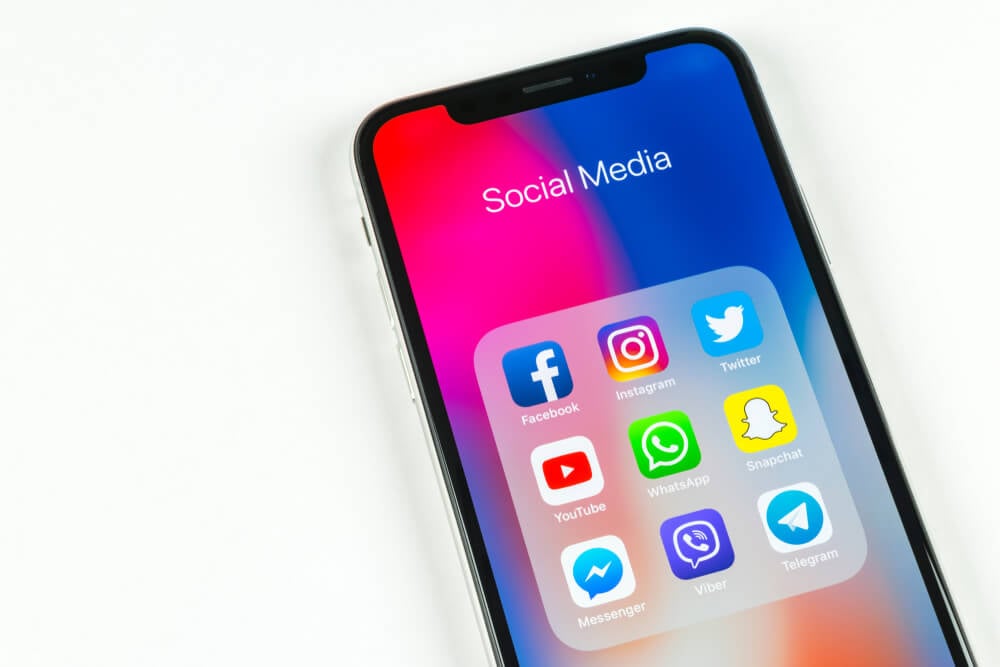 social media_Sankt-Petersburg, Russia, April 5, 2018: Apple iPhone X with icons of social media facebook, instagram, twitter, snapchat application on screen. Social media icons. Social network. Social media