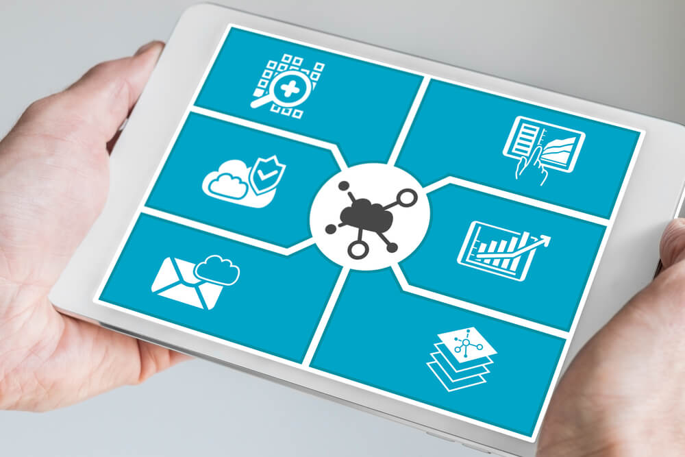 SaaS_Hand holding tablet. Concept of cloud computing dashboard for mobile devices.