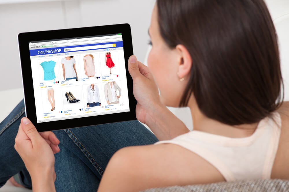 eCommerce_Close-up Of Woman Doing Online Shopping On Digital Tablet At Home
