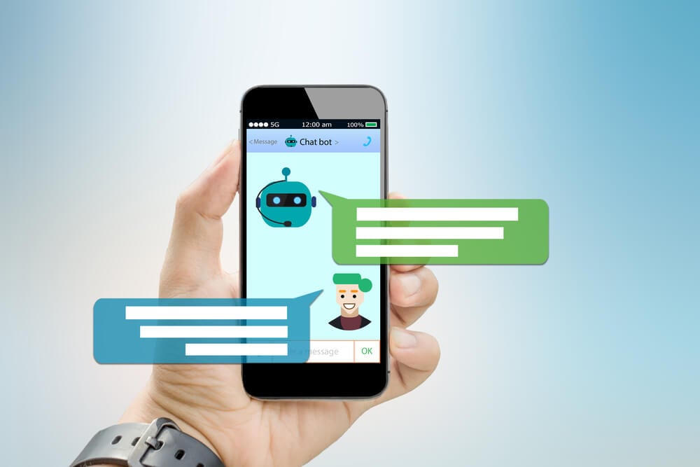 chatbot_Chatbot concept.Hands holding mobile phone on blurred abstract backgrounds