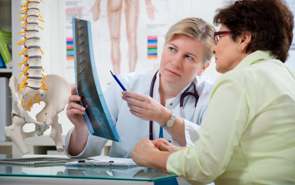 chiropractors_Doctor explaining x-ray results to patient