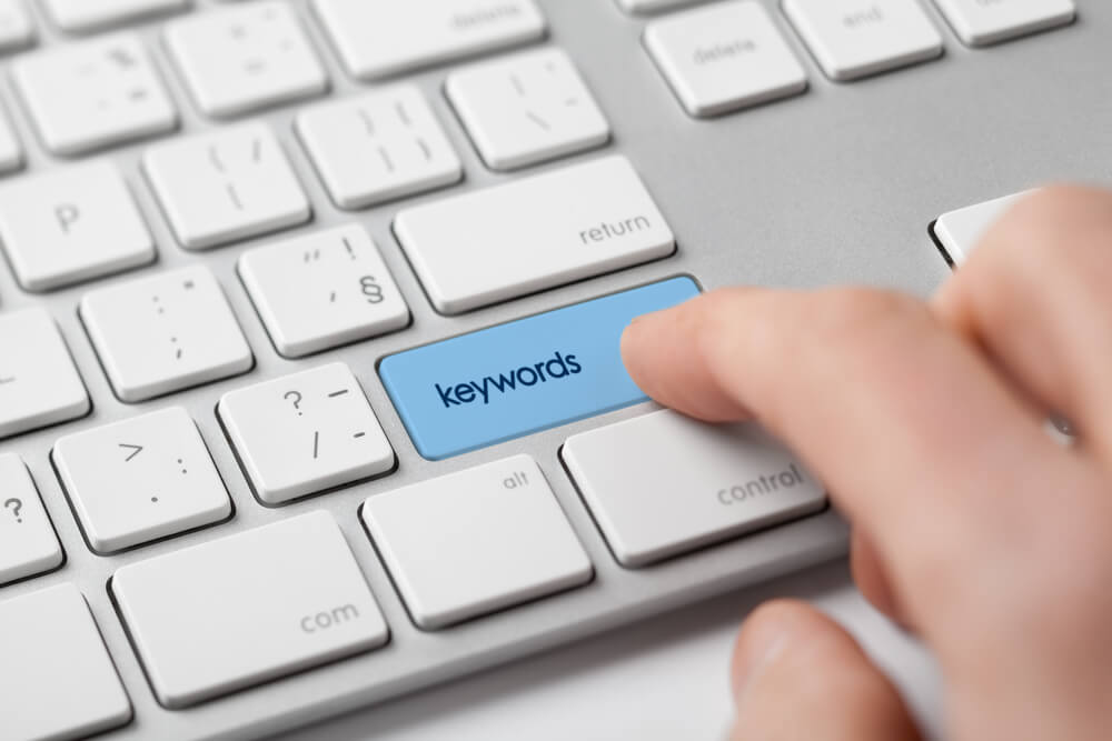 5 Great Local SEO Tactics Jumpstart New Medical Practices 2 keywords_Find keywords concept. Marketing specialist looking for keywords (concept with keyboard).