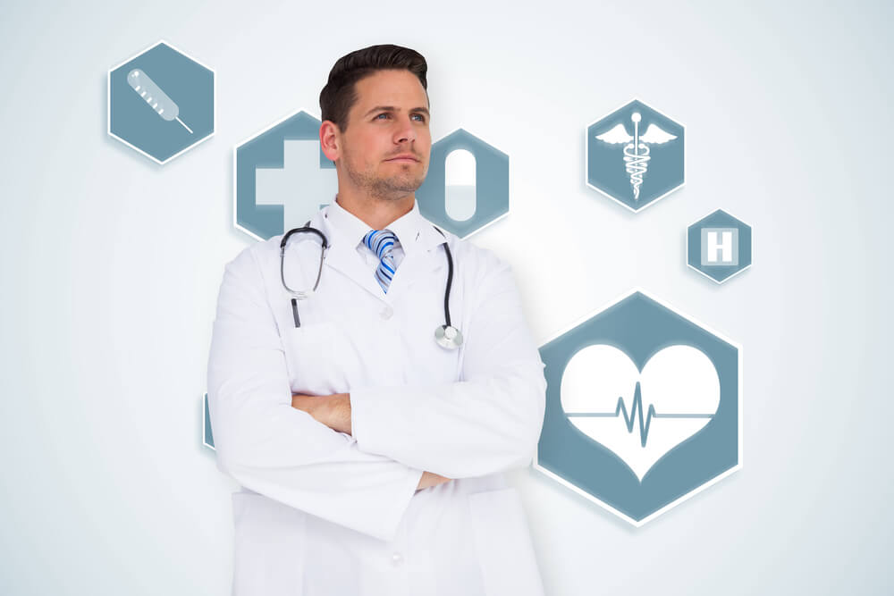 medical ROI_Handsome doctor with arms crossed against blue medical interface with icons