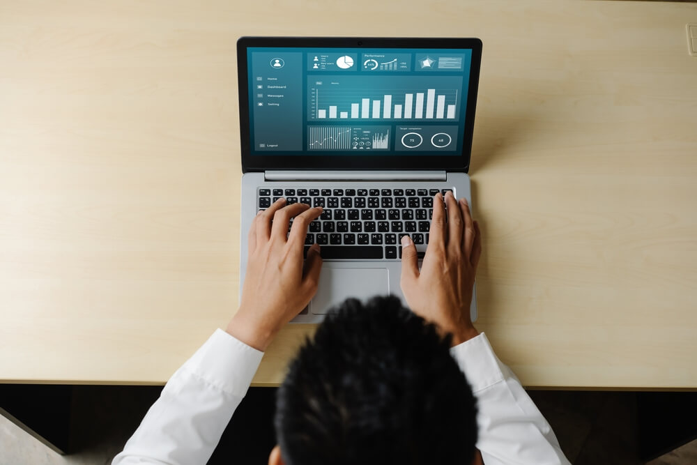 accounting SaaS_Business data dashboard analysis by ingenious computer software . Investment application display business sales and profit on the computer screen and advise marketing planning decision .