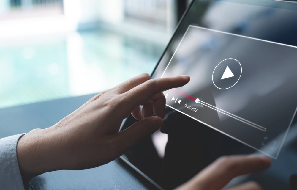 video marketing_Video marketing concept. Woman playing video content online streaming, running short clip on digital tablet. Marketing technology and advertising for online business, internet network