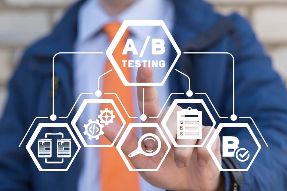 a/b testing_Man using virtual touchscreen presses inscription: A B TESTING. AB testing wireframe campaign for web website home homepage. AB Testing Method. Internet pages A-B comparison and split testing.