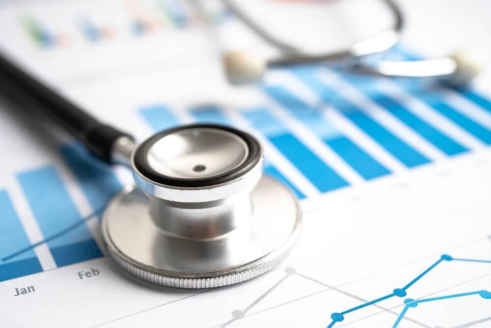healthcare ppc_Stethoscope on graph paper, Finance, Account, Statistics, Investment, Analytic research data economy and Business company concept.