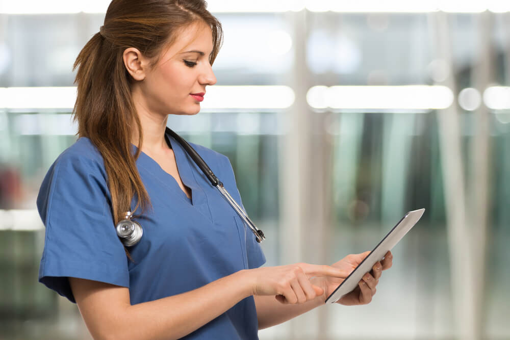 ppc for hospitals_Portrait of a nurse using a digital tablet