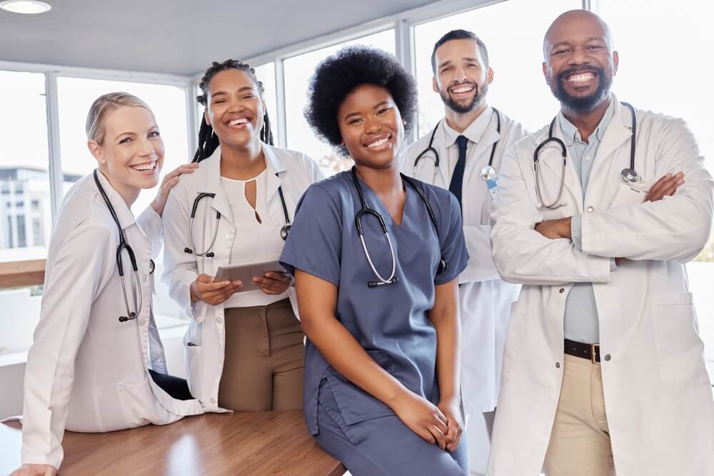 healthcare_Smile, portrait and hospital doctors, people or surgeon team for healthcare, help services or medical collaboration. Medicine health professional, clinic group solidarity or staff nurses for medicare