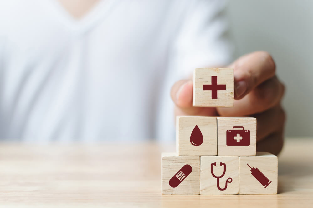 healthcare_Hand arranging wood block stacking with icon healthcare medical, Insurance for your health concept