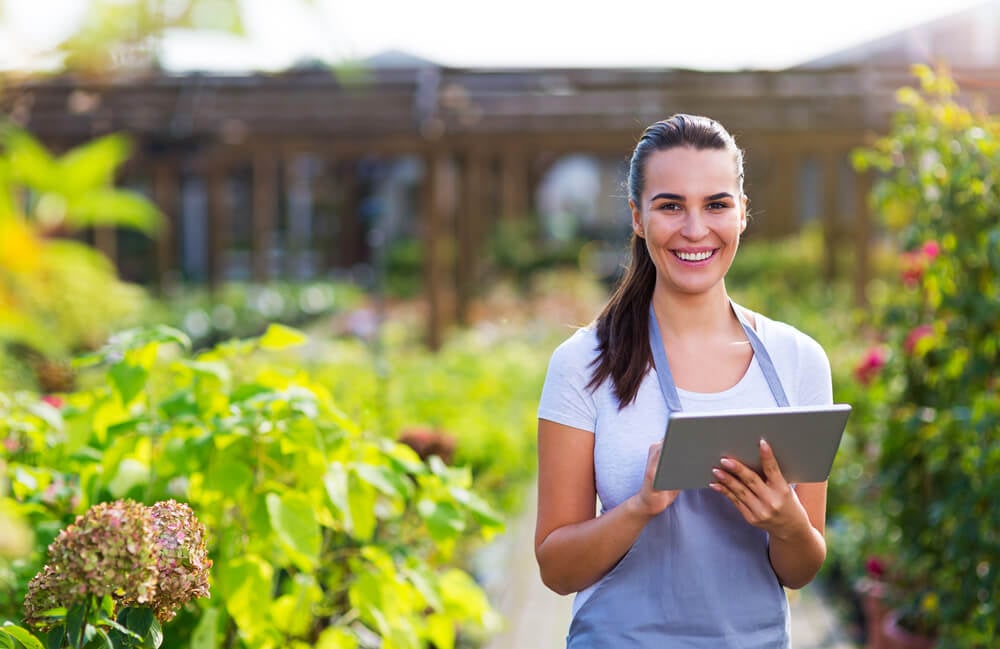 landscaping business_Garden center worker using digital tablet