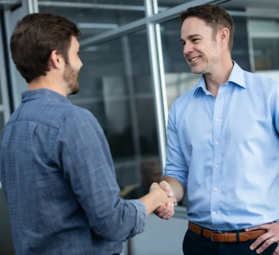 jason and reece shaking hands