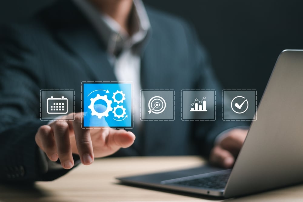 Automation concept. Businessman use laptop with virtual operations management technology related to business processes and workflows, high performance, monitoring and evaluation