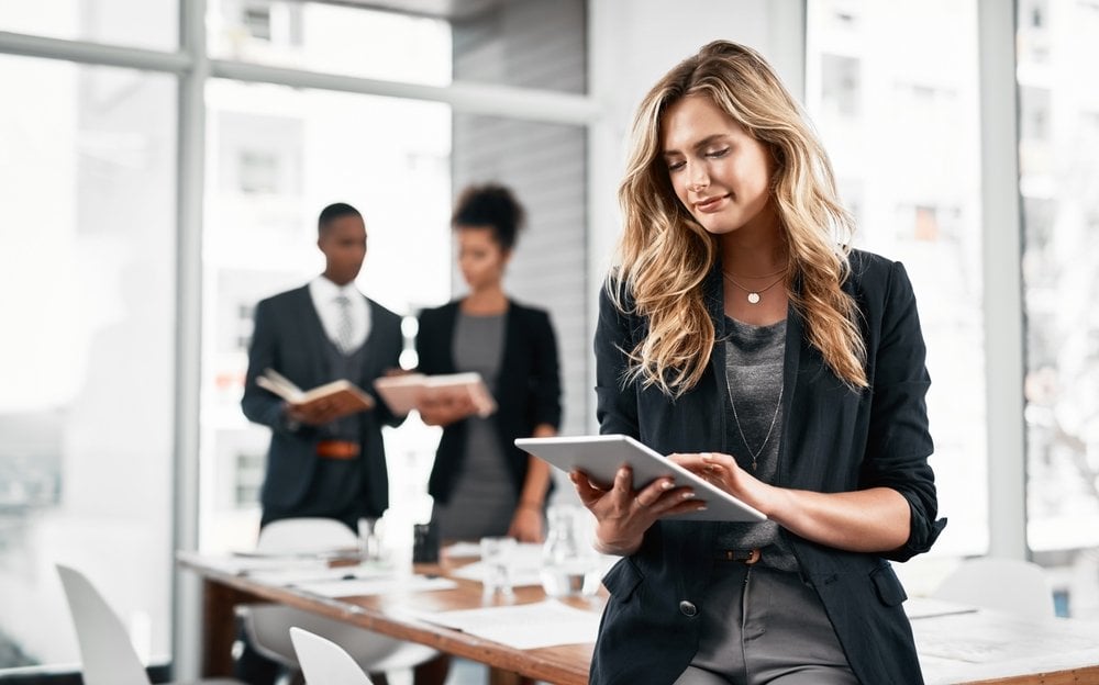 Business woman, tablet and online in office for research, networking and communication with news. Corporate lawyer, tech and reading press release in law firm for justice, contract and video evidence