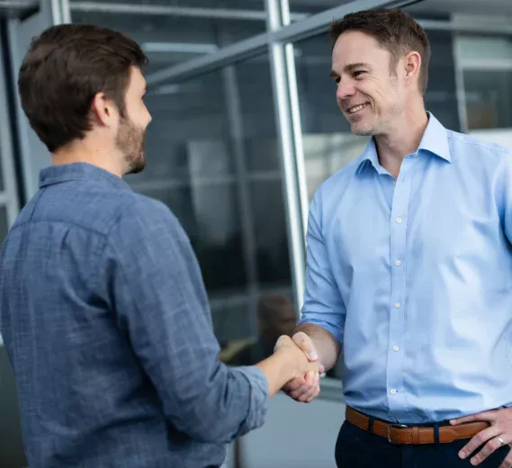 jason and reece shaking hands