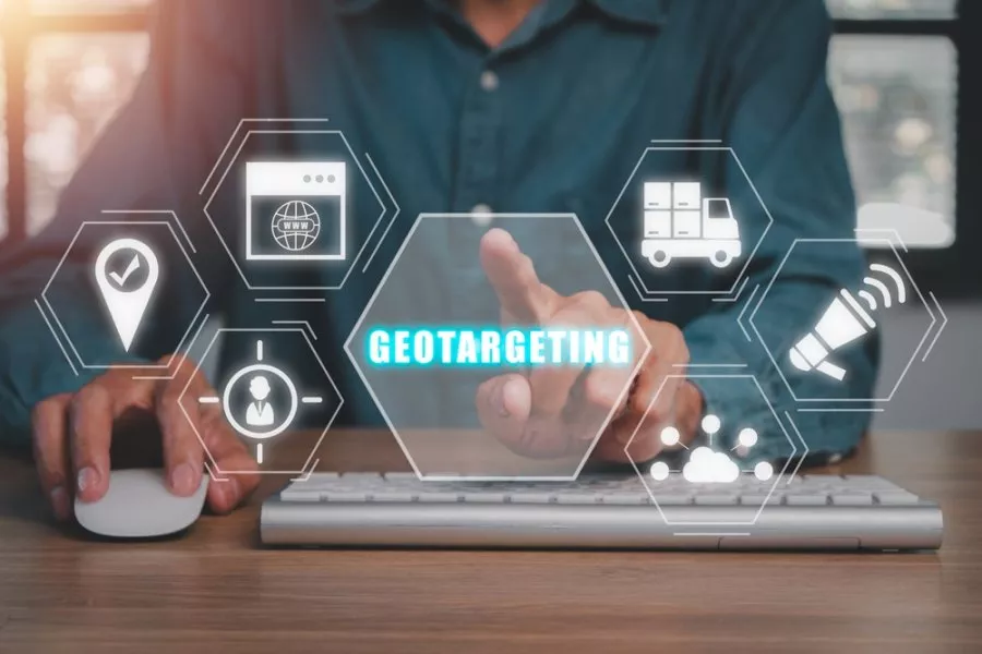 Geotargeting concept, Businessman hand touching geotargeting icon on virtual screen