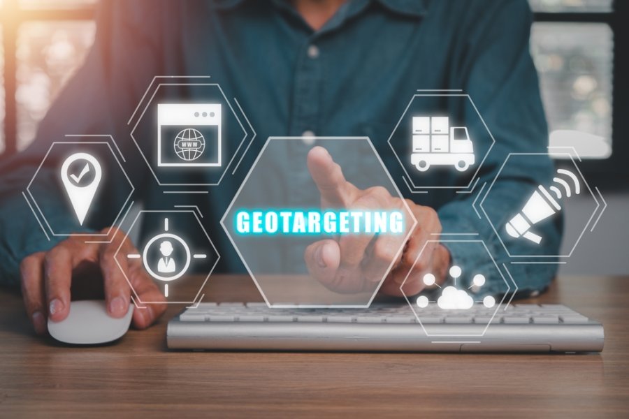Geotargeting concept, Businessman hand touching geotargeting icon on virtual screen