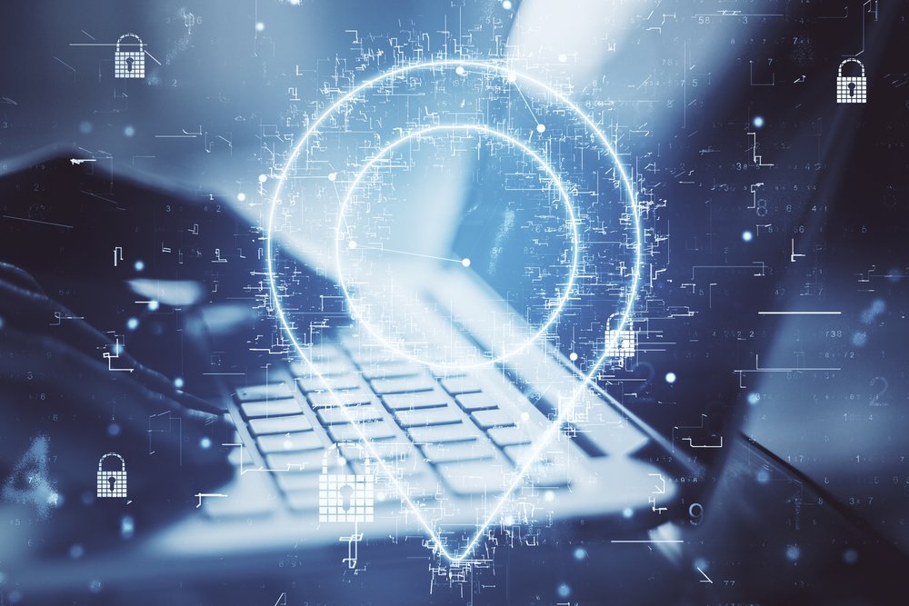 Geolocation internet technology with digital geolocation symbol and hands typing on laptop keyboard. Double exposure