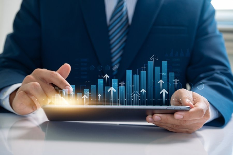Businessman use financial analytics and investment strategies leveraging digital technology to drive business growth and optimize economic performance in today's dynamic market