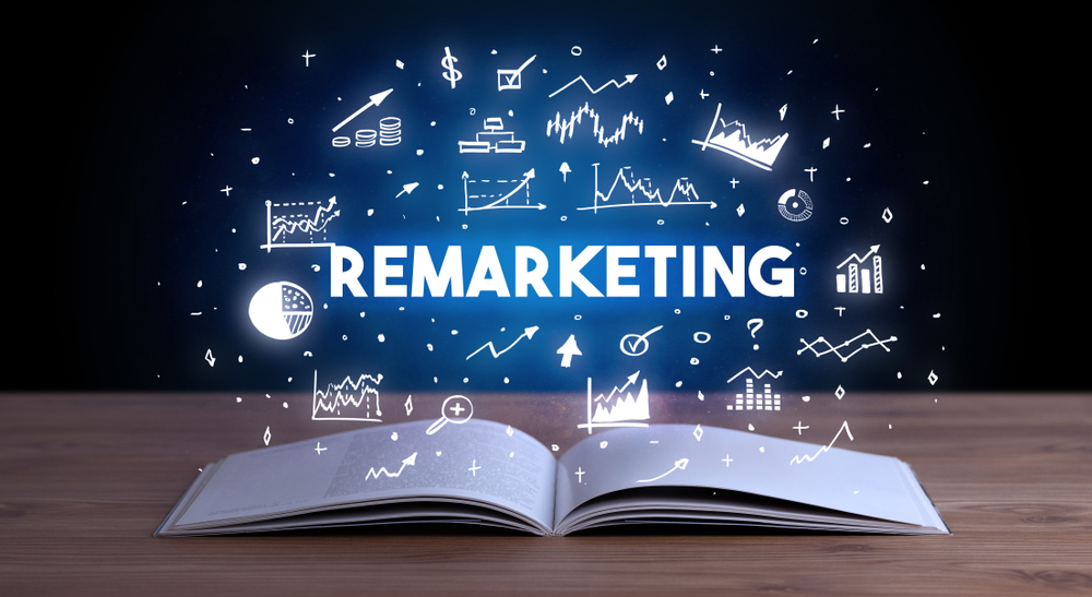 REMARKETING inscription coming out from an open book, business concept
