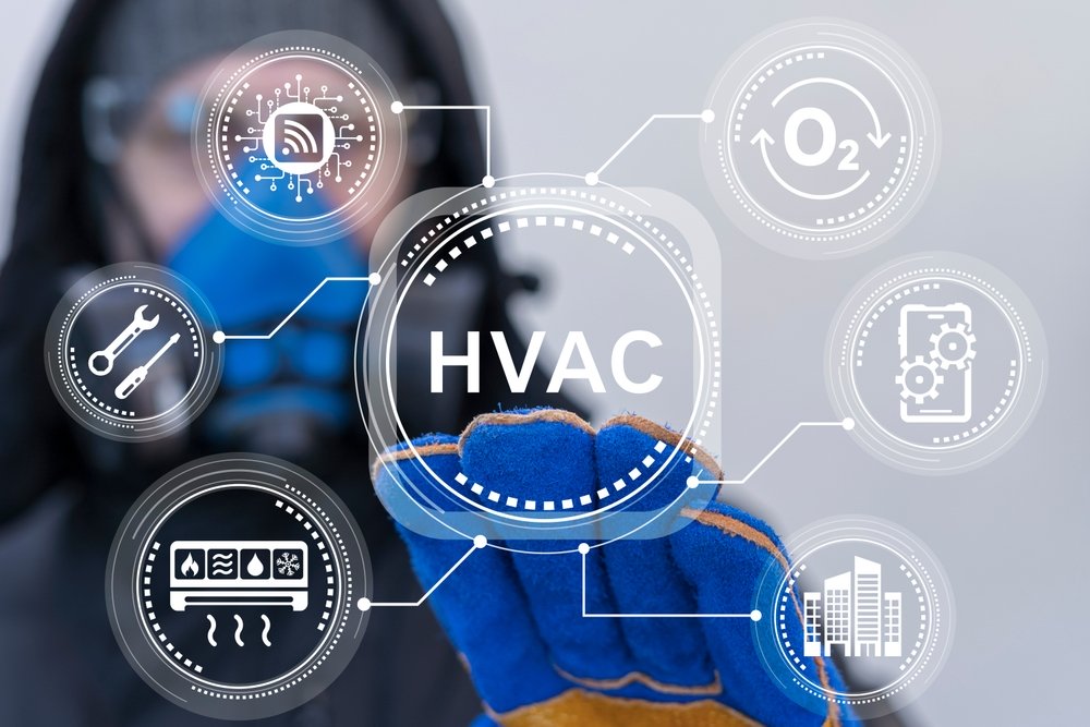 Worker using virtual touch screen presses abbreviation: HVAC. HVAC concept of Heating Ventilation Air Conditioning. Industrial and Home Air Conditioning Cooling Systems Repair Service.